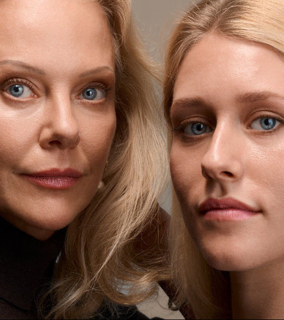 Two women with blonde hair and blue eyes looking directly at the camera.